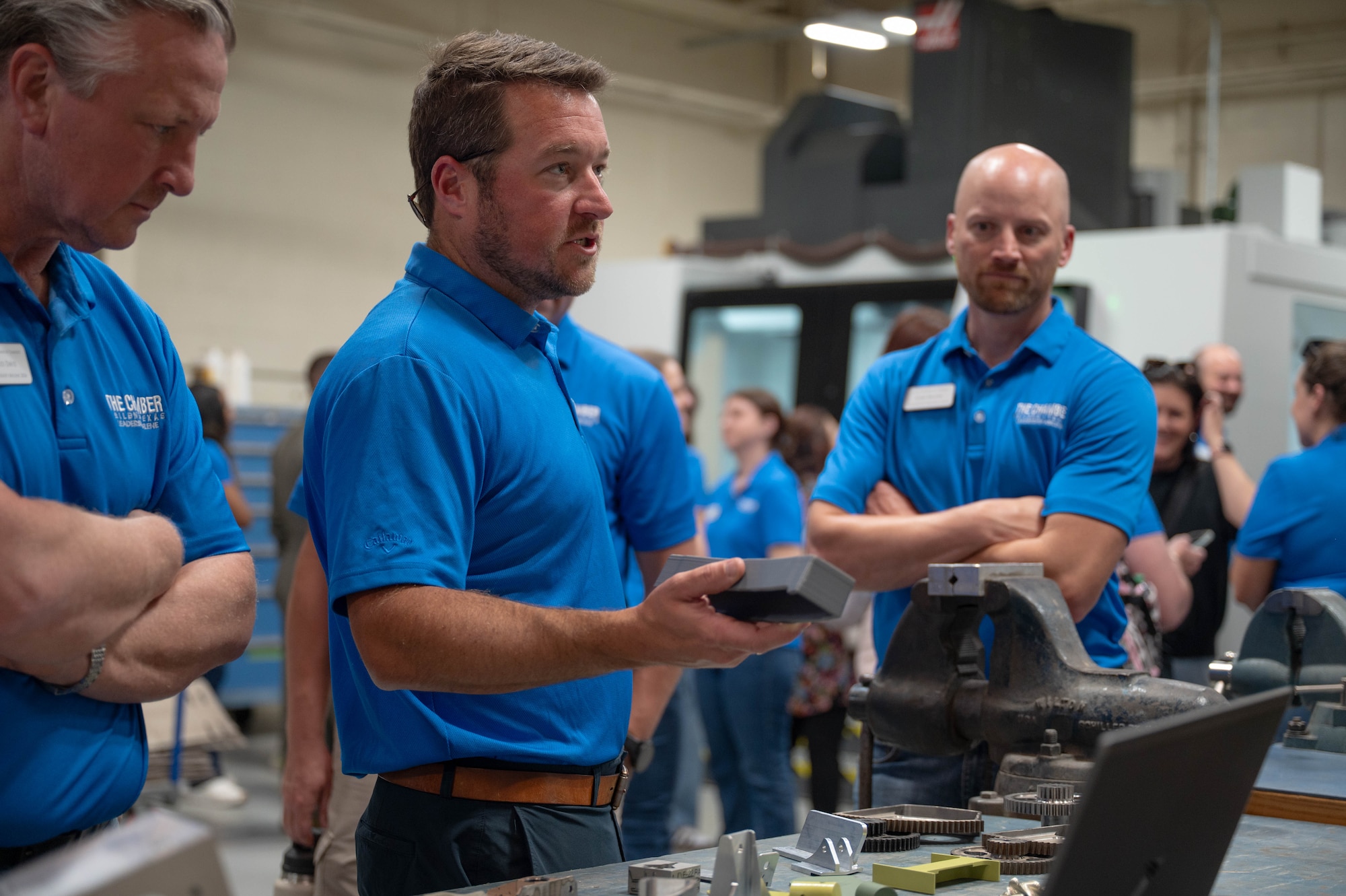 A member of the Leadership Abilene Class of 2026 asks a question about aircraft component fabrication at Dyess Air Force Base, Texas, March 19, 2026. The discussion provided insight into how Dyess fabricates parts to support aircraft maintenance. (U.S. Air Force photo by Airman 1st Class William Neal)