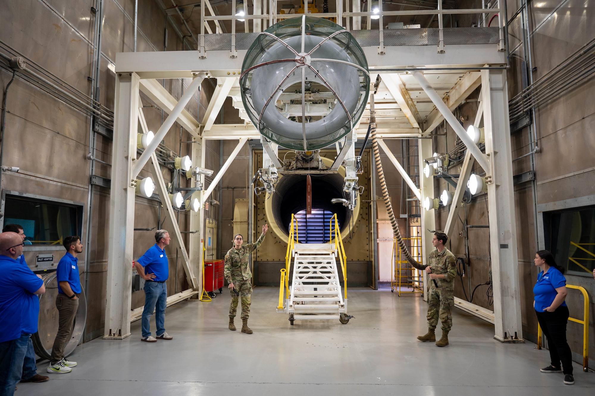 U.S. Air Force Staff Sgt. Ruby Stone, 7th Component Maintenance Squadron test cell craftsman, explains the function of a B-1B Lancer engine test cell to the Leadership Abilene Class of 2026 at Dyess Air Force Base, Texas, March 19, 2026. The tour highlighted engine testing processes that support aircraft reliability. (U.S. Air Force photo by Airman 1st Class William Neal)