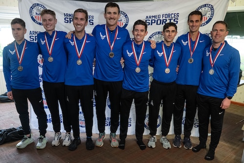 Men standing at awards ceremony