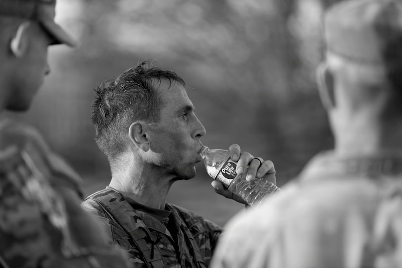 U.S. Army Staff Sgt. Shea Moody, with Headquarters and Headquarters Company, 149th Infantry Battalion, 75th Troop Command, takes a sip of water after he finished the ruck march at Wendel H. Ford Regional Training Center during the 2026 Best Warrior Competition March 22, 2026