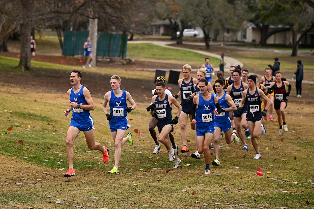 Male athletes run outdoors