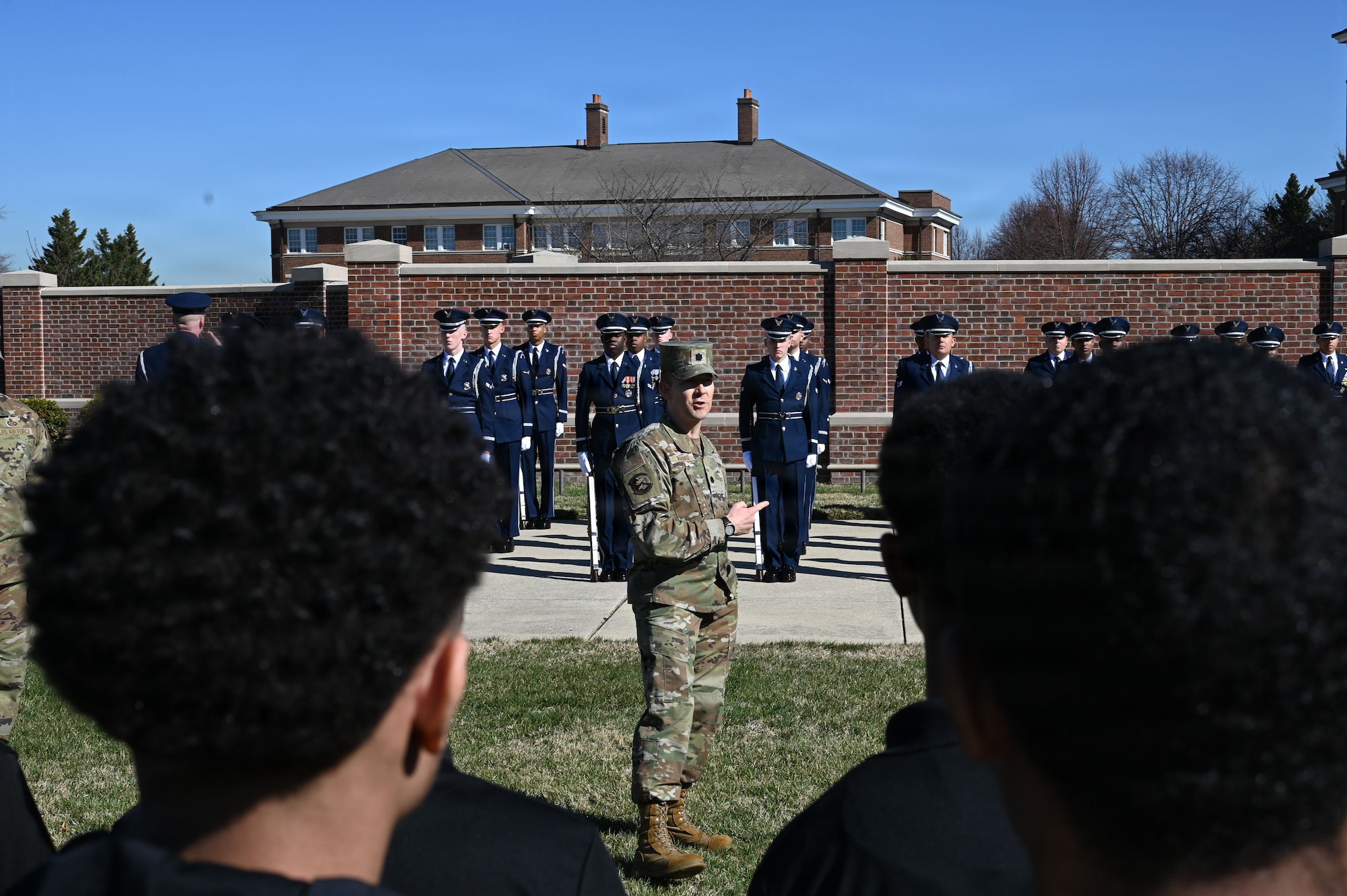 U.S. Air Force Lt. Col. Brandon Alford, commander of the U.S. Air Force Honor Guard, addresses Junior Reserve Officer Training Corps cadets during a tour of Joint Base Anacostia-Bolling, Washington, D.C., March 9, 2026. Alford explained the Honor Guard’s mission of connecting the American people to the Air Force and U.S. Space Force. (U.S. Air Force photo by Airman 1st Class Brandon Thomas)