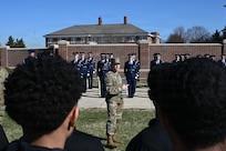 U.S. Air Force Lt. Col. Brandon Alford, commander of the U.S. Air Force Honor Guard, addresses Junior Reserve Officer Training Corps cadets during a tour of Joint Base Anacostia-Bolling, Washington, D.C., March 9, 2026. Alford explained the Honor Guard’s mission of connecting the American people to the Air Force and U.S. Space Force. (U.S. Air Force photo by Airman 1st Class Brandon Thomas)