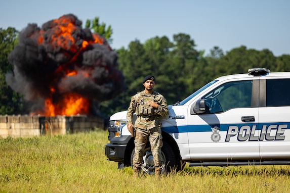 U.S. Air Force Staff Sgt. Salim Habibzai, team leader with the 116th Security Forces Squadron, 116th Air Control Wing, poses during an explosive ordnance demonstration at Robins Air Force Base, Georgia, June 26, 2024. Security Forces Airmen not only defend air bases, but also assists local law enforcement during domestic operations. (U.S. Air National Guard photo by Master Sgt. Jeff Rice)