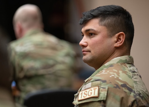 U.S. Air Force Master Sgt. Jacob Siluano, 97th Force Support Squadron and 97th Contracting Flight first sergeant, listens to a mental health services briefing during a Mental Health Symposium at Altus Air Force Base, Oklahoma, March 17, 2026. The symposium aimed to go beyond formal presentations by fostering meaningful discussions and strengthening collaboration between base leadership and the helping agencies that support Airmen across the installation. (U.S. Air Force photo by Airman 1st Class Emma Wright)