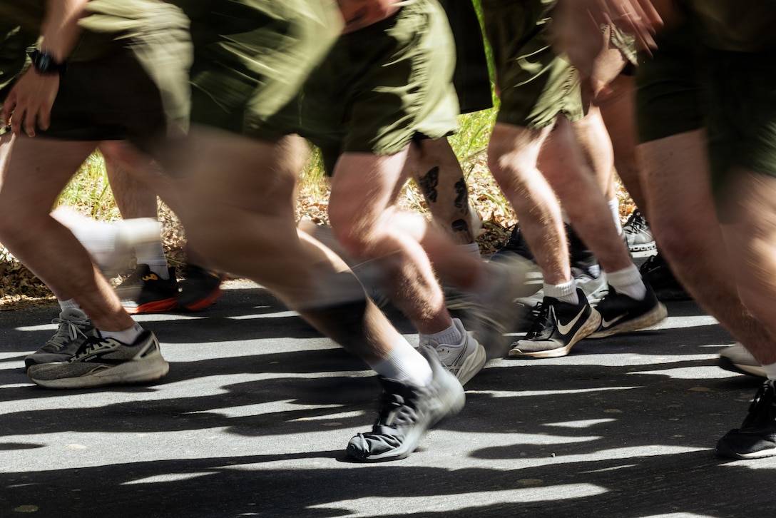U.S. Marines with 1st Marine Division begin a 3-mile run for a physical fitness test during the annual 1st MARDIV squad competition at Marine Corps Base Camp Pendleton, California, March 16, 2026. The 1st MARDIV squad competition is a four-day event that evaluates a Marine rifle squad’s infantry skills, fitness, toughness, and small unit tactics. (U.S. Marine Corps photo by Sgt. Vincent Needham)