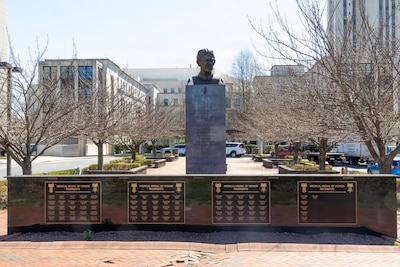 Outside Building 19, America Zone, near the bust of the medical center’s namesake, U.S. Army Maj. Walter Reed, is a set of four black marble walls with 81 names of medical Medal of Honor recipients etched in gold on them.