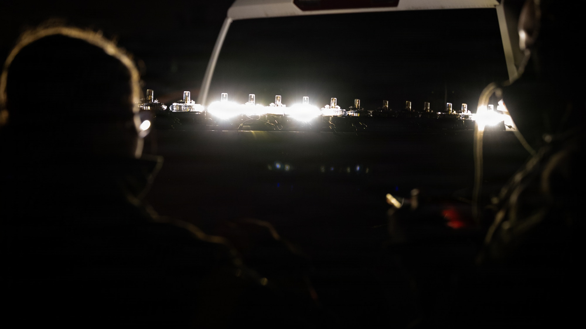 U.S. Air Force Airmen assigned to the 51st Operations Support Squadron and the 51st Civil Engineer Squadron test a lighting system on a minimum operating strip during exercise Freedom Shield 26 at Osan Air Base, Republic of Korea
