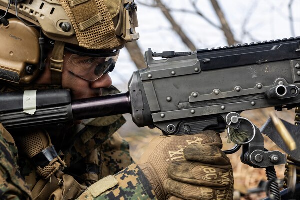 U.S. Marine Corps Lance Cpl. Marcus Johnson, a machine gunner with 12th Littoral Combat Team, 12th Marine Littoral Regiment, 3rd Marine Division, fires an M240B machine gun during a Combined Arms Live-Fire Exercise at Rodriguez Live-Fire Complex, Republic of Korea, March 3, 2026. 12th LCT Marines executed a company-level CALFEX, integrating organic and supporting fires, maneuver elements, and reconnaissance capabilities to conduct a coordinated assault on a designated objective. The range strengthened the unit’s ability to synchronize fires and movement in a dynamic training environment while enhancing combat effectiveness and overall readiness. Johnson is a native of Texas. (U.S. Marine Corps photo by Cpl. Rodney Frye)