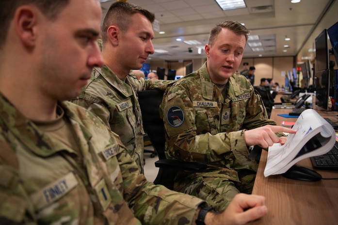 U.S. Space Force Tech. Sgt. James Challman, Space Training and Readiness Command’s non-commissioned officer in charge of the Cadet Space Operations Squadron in the Department of Astronautics, U.S. Air Force Academy, discusses exercise control plans during exercise Freedom Shield 26 at Osan Air Base, Republic of Korea, March 12, 2026. Challman served as an exercise control specialist during FS26, directing scenarios and adjudicating the effectiveness of simulated actions by exercise participants. (U.S. Space Force photo by 2nd Lt. Andrew Taller