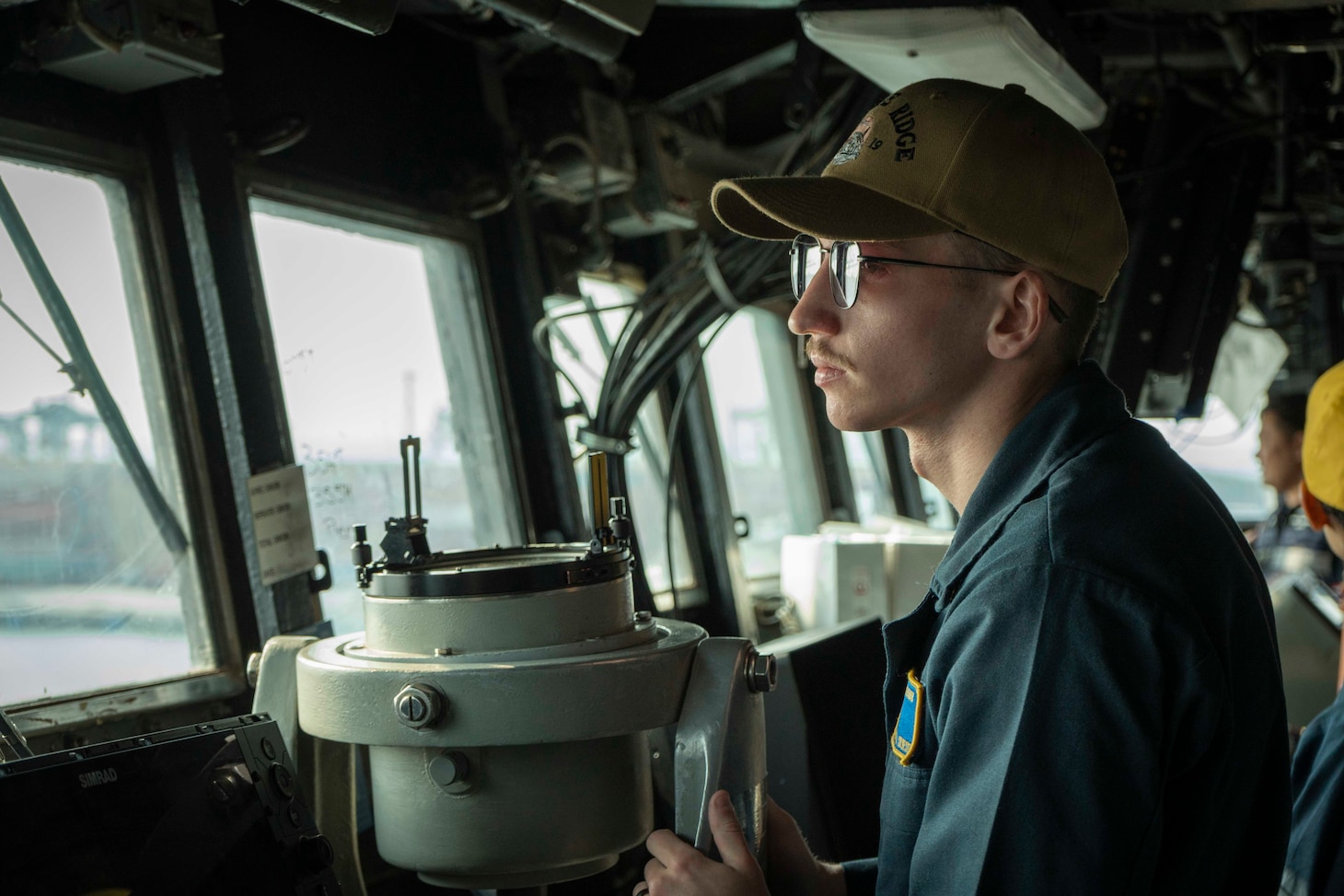 Ensign Chance Sylvester stands watch on the bridge aboard U.S. 7th Fleet flagship USS Blue Ridge (LCC 19) as the ship prepares to enter port in Laem Chabang, Thailand, March 26, 2026.