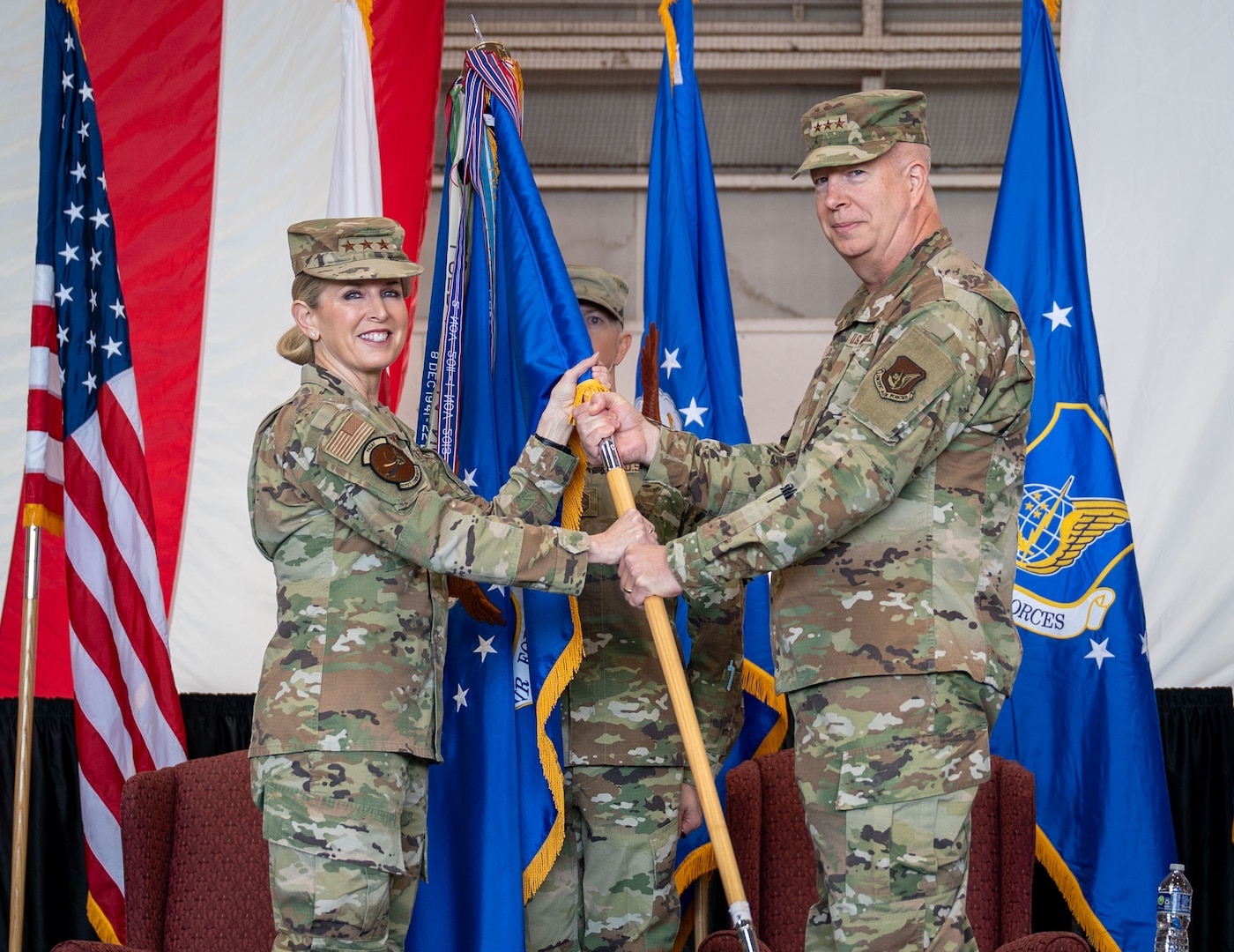 U.S. Air Force Lt. Gen. Laura Lenderman, Pacific Air Forces deputy commander, presents the guidon to Lt. Gen. Joel Carey, 5th Air Force incoming commander, during the 5AF change of command ceremony at Yokota Air Base, Japan, March 24, 2026. This momentous change to the 5AF structure demonstrates the Department’s commitment to Japan and maintaining the security and stability in DoD’s priority theater. (U.S. Air Force photo by Airman 1st Class Kayla Karelas)