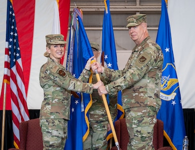 U.S. Air Force Lt. Gen. Laura Lenderman, Pacific Air Forces deputy commander, presents the guidon to Lt. Gen. Joel Carey, 5th Air Force incoming commander, during the 5AF change of command ceremony at Yokota Air Base, Japan, March 24, 2026. This momentous change to the 5AF structure demonstrates the Department’s commitment to Japan and maintaining the security and stability in DoD’s priority theater. (U.S. Air Force photo by Airman 1st Class Kayla Karelas)
