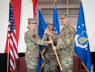 U.S. Air Force Lt. Gen. Stephen Jost, U.S. Forces Japan commander and outgoing 5th Air Force commander, relinquishes the guidon to Lt. Gen. Laura Lenderman, Pacific Air Forces deputy commander, during the 5AF change of command ceremony at Yokota Air Base, Japan, March 24, 2026. The separation of 5AF will strengthen the command-and-control framework to enable seamless coordination of operations and capabilities, allowing for greater interoperability between U.S. and Japanese forces. (U.S. Air Force photo by Airman 1st Class Kayla Karelas)