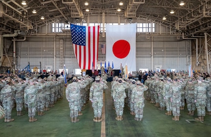 U.S. Forces Japan, 5th Air Force, and 374th Airlift Wing members assemble for a change of command ceremony at Yokota Air Base, Japan, March 24, 2026. USFJ and 5AF dual-commander position was separated, strengthening the command-and-control framework to enable seamless coordination of operations and capabilities, allowing for greater interoperability between U.S. and Japanese forces. (U.S. Air Force photo by Airman 1st Class Kayla Karelas)