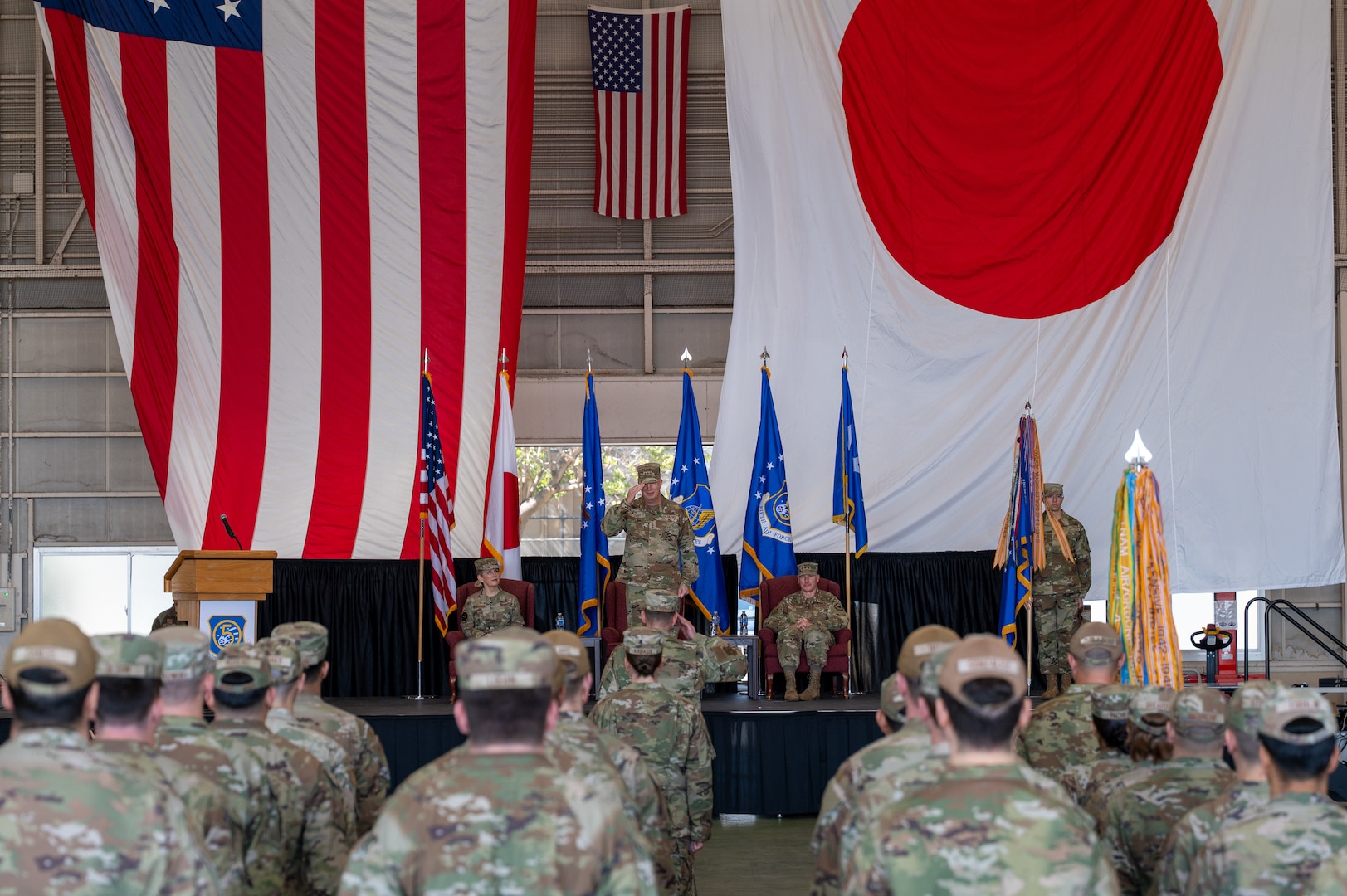 U.S. Air Force Lt. Gen Joel Carey, 5th Air Force incoming commander, renders the first salute as commander during a change of command ceremony at Yokota Air Base, Japan, March 24, 2026. 5 AF's commander separation is designed to enable more flexible joint and bilateral operations with the JASDF. This shift to a more distributed and resilient posture will enhance the alliance's ability to deter threats and respond to crises together. (U.S. Air Force photo by Airman 1st Class David S. Calcote)