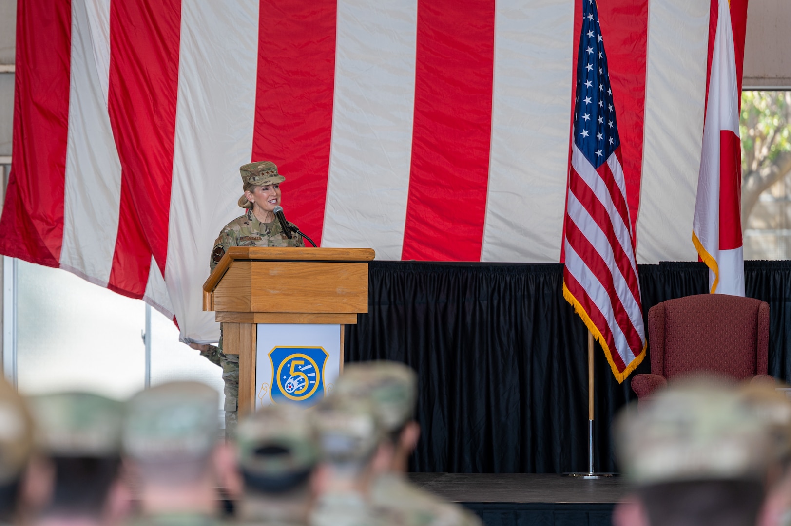 U.S. Air Force Lt. Gen. Laura Lenderman, Pacific Air Forces deputy commander, speaks during the 5th Air Force change of command ceremony at Yokota Air Base, Japan, March 24, 2026. A dedicated commander will optimize coordination with Pacific Air Forces, allowing leadership to focus exclusively on ensuring 5 AF's capabilities and readiness are in lockstep with the broader strategy set by PACAF in Hawaii, creating a more cohesive air command structure in the region. (U.S. Air Force photo by Airman 1st Class David S. Calcote)