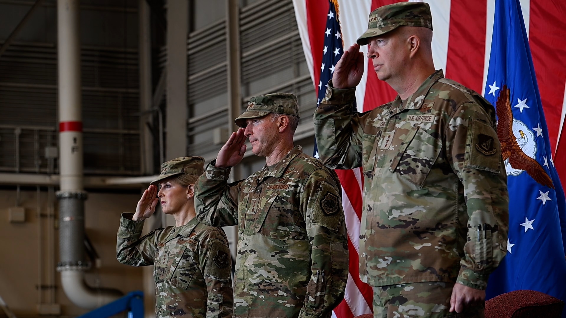 U.S. Air Force Lt. Gen Joel Carey, 5th Air Force incoming commander, Lt Gen Stephen Jost, outgoing commander, and Lt Gen Laura Lenderman, Pacific Air Forces deputy commander, render a salute during the national anthem during a change of command ceremony at Yokota Air Base, Japan, March 24, 2026. 5 AF's commander separation is designed to enable more flexible joint and bilateral operations with the JASDF. This shift to a more distributed and resilient posture will enhance the alliance's ability to deter threats and respond to crises together. (U.S. Marine photo by Sgt. Mitchell Johnson)