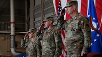 U.S. Air Force Lt. Gen Joel Carey, 5th Air Force incoming commander, Lt Gen Stephen Jost, outgoing commander, and Lt Gen Laura Lenderman, Pacific Air Forces deputy commander, render a salute during the national anthem during a change of command ceremony at Yokota Air Base, Japan, March 24, 2026. 5 AF's commander separation is designed to enable more flexible joint and bilateral operations with the JASDF. This shift to a more distributed and resilient posture will enhance the alliance's ability to deter threats and respond to crises together. (U.S. Marine photo by Sgt. Mitchell Johnson)