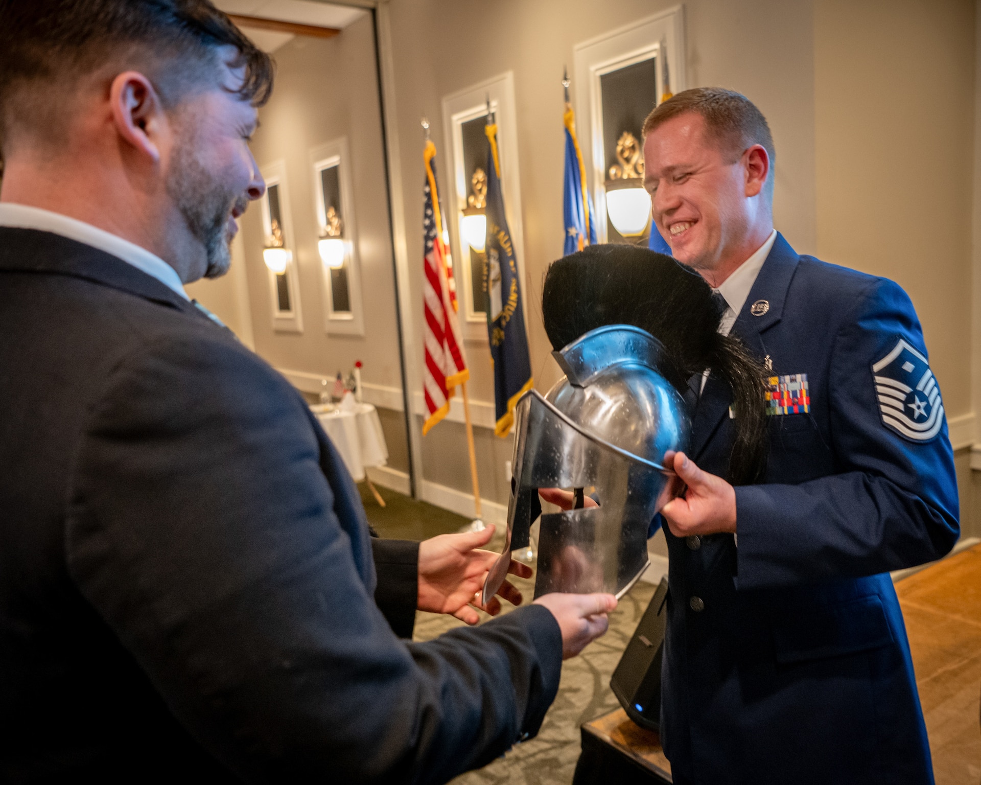 Master Sgt. Josh Pence, right, the Kentucky Air National Guard’s 2026 First Sergeant of the Year, is recognized during the Airman’s Gala at Wildwood Country Club in Louisville, Ky., March 14, 2026. The Gala celebrated wing Airmen who displayed exceptional performance and community engagement in 2025. (U.S. Air National Guard photo by Master Sgt. Joshua Horton)