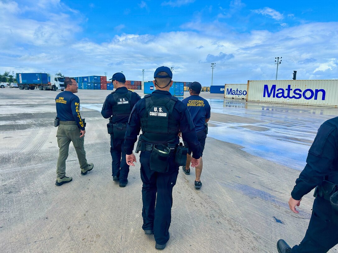 Members of the U.S. Coast Guard Sector Boarding Team work with CNMI’s Customs and Biosecurity personnel at the port on March 19, 2026, in Saipan. From March 18-22, conducted joint underway and shoreside operations alongside the CNMI Department of Public Safety, Saipan Marine Unit, and Saipan Customs and Biosecurity, reinforcing direct lines of communication and cooperation that strengthen maritime domain awareness across the CNMI's waters and surrounding exclusive economic zone. (U.S. Coast Guard photo by Petty Officer 1st Class Chris Farrell)