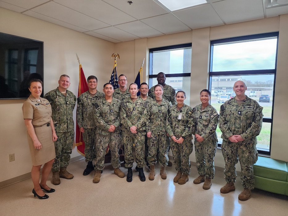 (260316-N-N1526-1001) NORFOLK, Va. U.S. Navy instructors and junior industrial hygiene officers (IHOs) posed for a group photo while attending the IHO indoctrination course held at the Navy Environmental and Preventive Medicine Unit (NEPMU) 2 aboard Naval Station Norfolk, March 16. The course is designed for new IHOs to include new accessions and lateral transfers from other U.S. Navy officer communities, and consists of professional military topics, industrial hygiene technical and community-specific topics, and field trips or tours to aircraft carriers, air units and a military treatment facility. Pictured from left to right: Lt. Cmdr. Daniela Sloan, Lt. Cmdr. Jordan Koyle, Lt. j.g. Andrew Donovan, Lt. John Sodusta, Lt. j.g. Adam Rives, Lt. j.g. Aislynn O’Shea, Lt. Cmdr. Christopher Low, Lt. j.g. Khadimou Dia, Lt. Yana Villanueva, Ensign Kira Kavanaugh, Lt. j.g. Tram Dan, and Cmdr. Cody Schaal. (U.S. Navy photo by Lt. Cmdr. Christopher Wooden) (Portions of this photo have been blurred for security purposes)