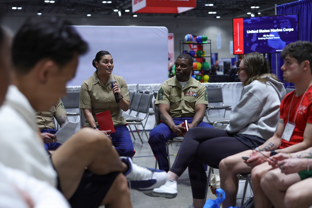 U.S. Marine Corps Lt. Col. Evita Mosqueda, the Assistant Event Coordinator, Marine Forces South, speaks to educators at a Fit-to-Win talk about resiliency at the Society of Health and Physical Educators Partnership convention in Kansas City, Mo., March 19, 2026. The Fit-to-Win program is used in conjunction with several national partnership to highlight the Marine Corps’ values of mental and physical resiliency. (U.S. Marine Corps photo by Staff Sgt. Joseph Drewsen)