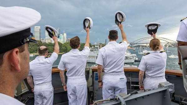 U.S. Navy Sailors assigned to Arleigh Burke-class guided-missile destroyer USS Fitzgerald (DDG 62) render honors to the Leeuwin-class survey ship HMAS Leeuwin (A 245) during a fleet review as a part of Exercise Kakadu in Sydney, March 21, 2026.