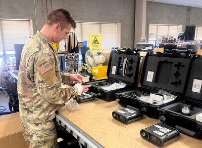 Spc. Dylan Sivils, a biomedical equipment specialist, inspects the hardware accompanying a new portable ventilator system at U.S. Army Medical Logistics Command’s Medical Maintenance Operations Division at Hill Air Force Base, Utah. MMOD-UT, which serves as a center of excellence for pulmonary, anesthesia and oxygen-concentrating medical equipment, provided a virtual training March 12 on the new vent system, supporting over a dozen technicians both in Utah and AMLC’s Forward Repair Activity-Medical, or FRA-M, site in Fort Bragg, North Carolina.