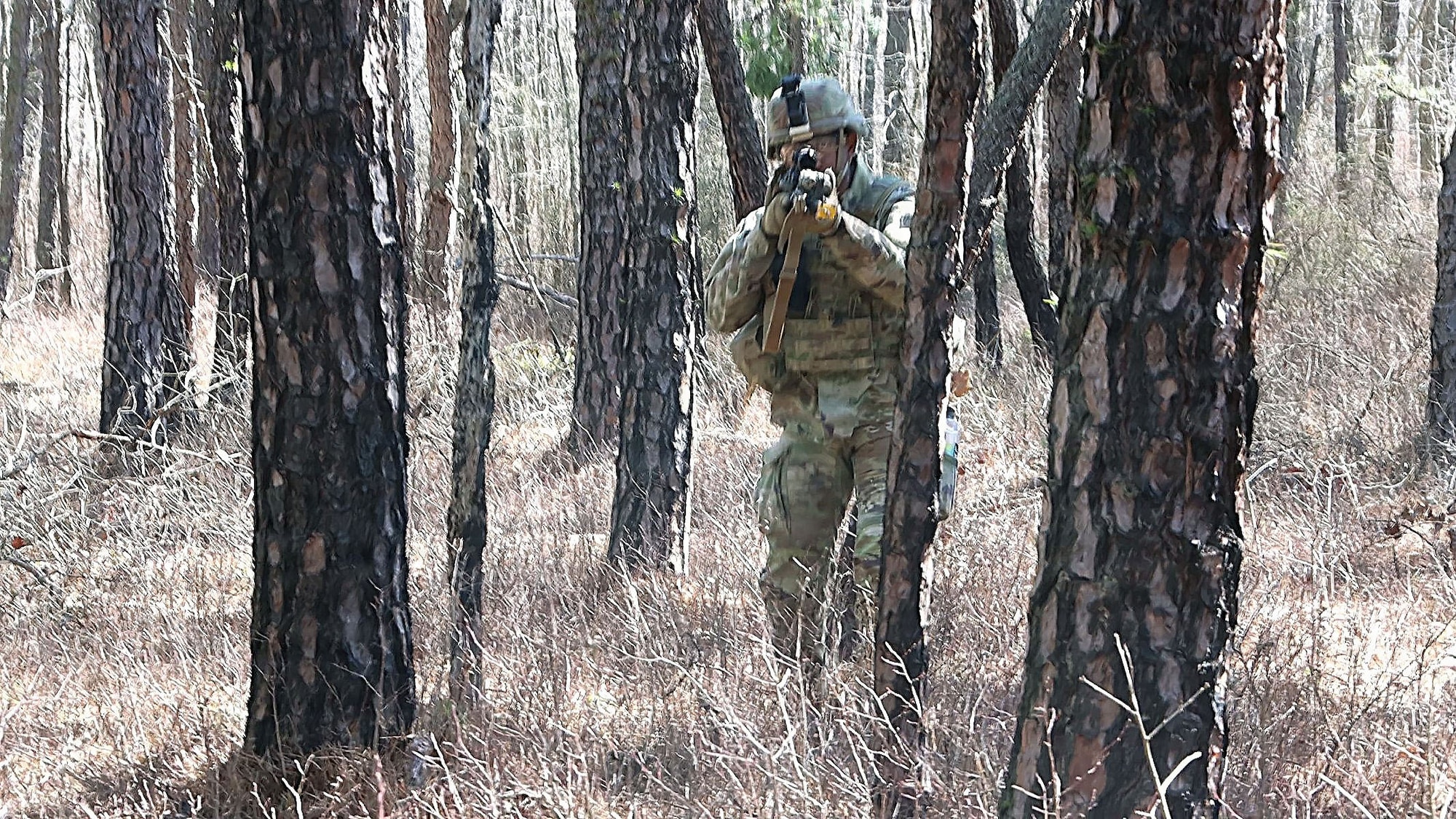 A U.S. infantry Soldier assigned to the 1st Battalion, 175th Infantry Regiment, Maryland Army National Guard maneuvers through wooded terrain during a field training exercise at Joint Base McGuire-Dix-Lakehurst, N.J., March 15, 2026. The FTX focused on training in preparation for upcoming deployments, team development and unit synchronization. (U.S. Army photo by Steven Roussel)