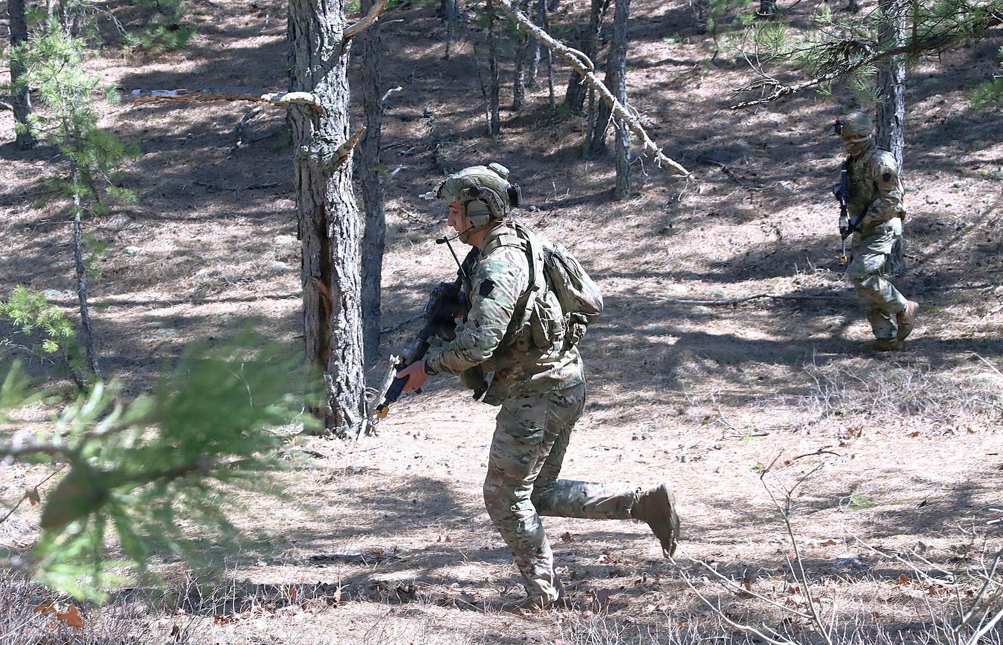 U.S. infantry Soldiers assigned to the 1st Battalion, 175th Infantry Regiment, Maryland Army National Guard maneuver through wooded terrain during a field training exercise at Joint Base McGuire-Dix-Lakehurst, N.J., March 15, 2026. The FTX focused on training in preparation for upcoming deployments, team development and unit synchronization. (U.S. Army photo by Steven Roussel)