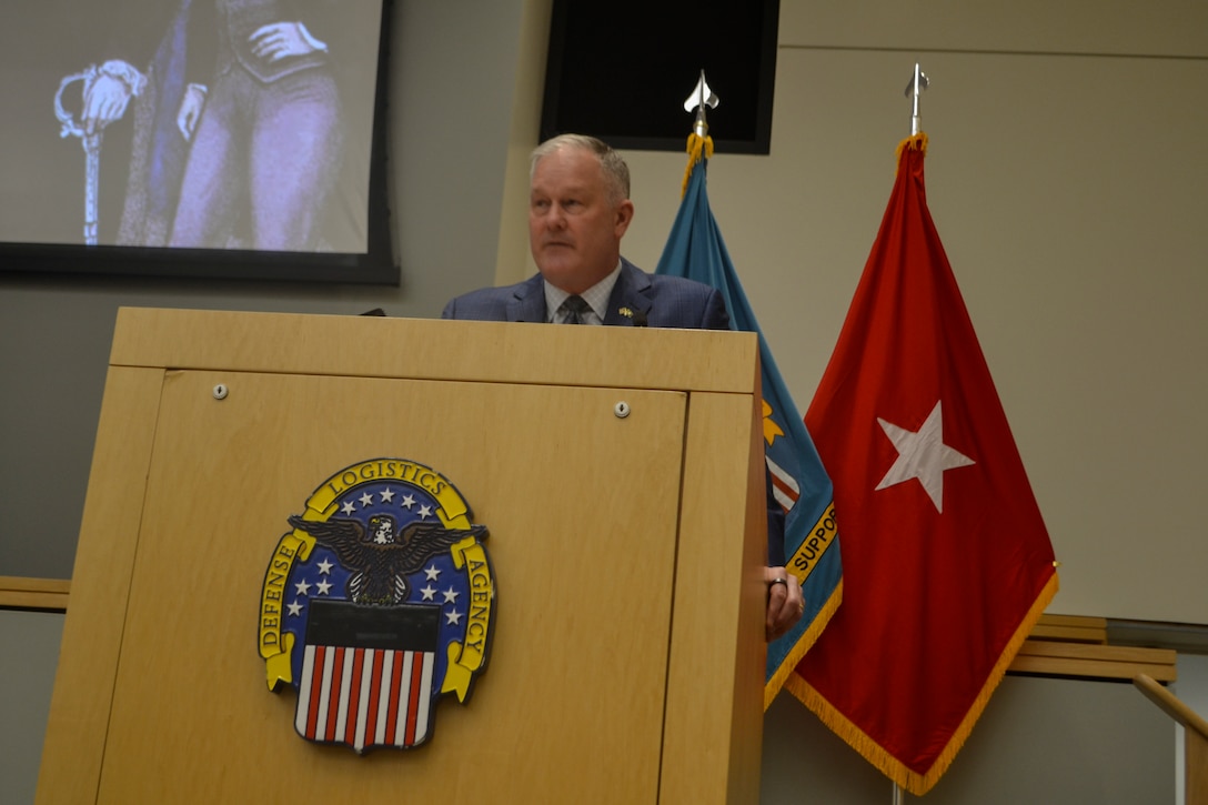 DLA Troop Support Deputy Commander Christopher Mosher administers the Oath of Office to the agency's newest employees, emphasizing their commitment to serving the nation. He underscored that taking the oath signifies a pledge of loyalty to the U.S. Constitution, joining an unbroken chain of service vital to warfighter readiness. These new civilian members will play an essential role in supporting the military and strengthening national security.