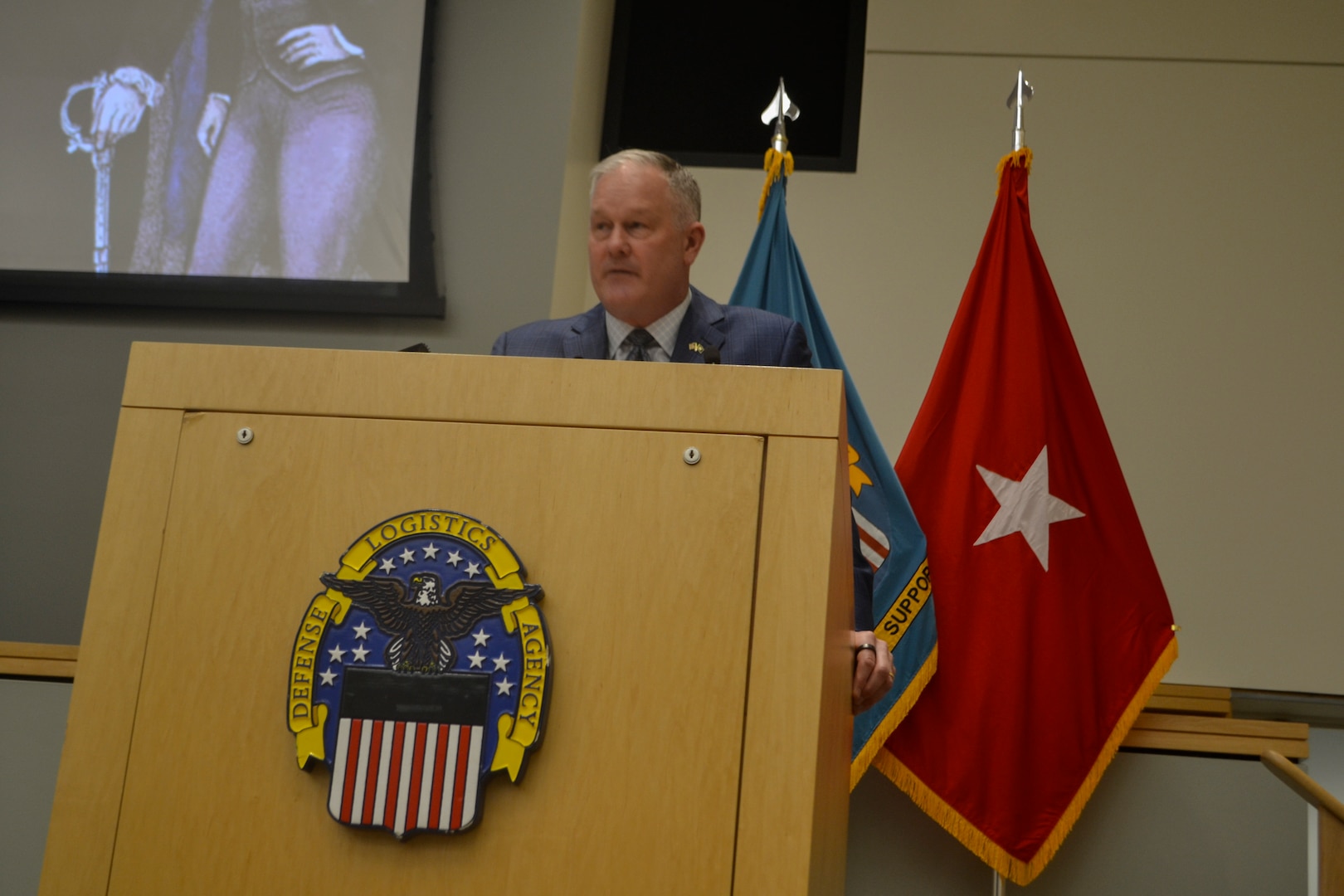 DLA Troop Support Deputy Commander Christopher Mosher administers the Oath of Office to the agency's newest employees, emphasizing their commitment to serving the nation. He underscored that taking the oath signifies a pledge of loyalty to the U.S. Constitution, joining an unbroken chain of service vital to warfighter readiness. These new civilian members will play an essential role in supporting the military and strengthening national security.
