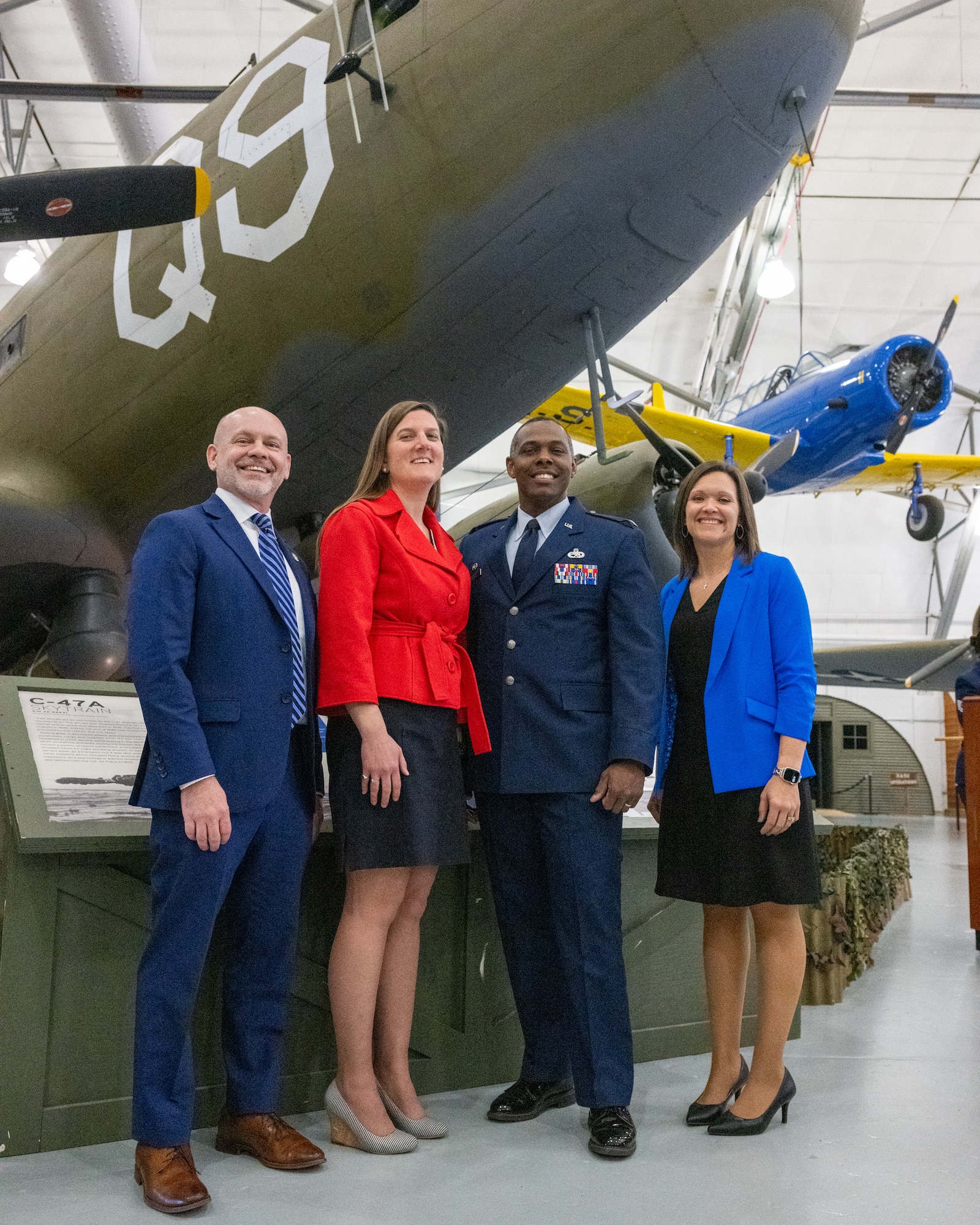 U.S. Air Force Reserve Col. Jerome Rogers, 512th Maintenance Group commander, poses for a photo with honorary commander inductees during the Class of 2026 HCC Induction Ceremony at the Air Mobility Command Museum, Dover Air Force Base, Delaware, March 24, 2026. Thirty-five new members toured the base earlier in the day and were inducted into the HCC program during a formal ceremony. (U.S. Air Force photo by Mauricio Campino)