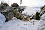 Spc. Sean Foley, an M-240L machine gun gunner with Avalanche Company, 2nd Battalion, 297th Infantry Regiment, engages targets March 21, 2026, during infantry squad drills at the Joint Base Elmendorf-Richardson Infantry Platoon Battle Course. M-240L 7.62mm machine guns are five pounds lighter than the older M-240G model. Photo by Maj. David Bedard.