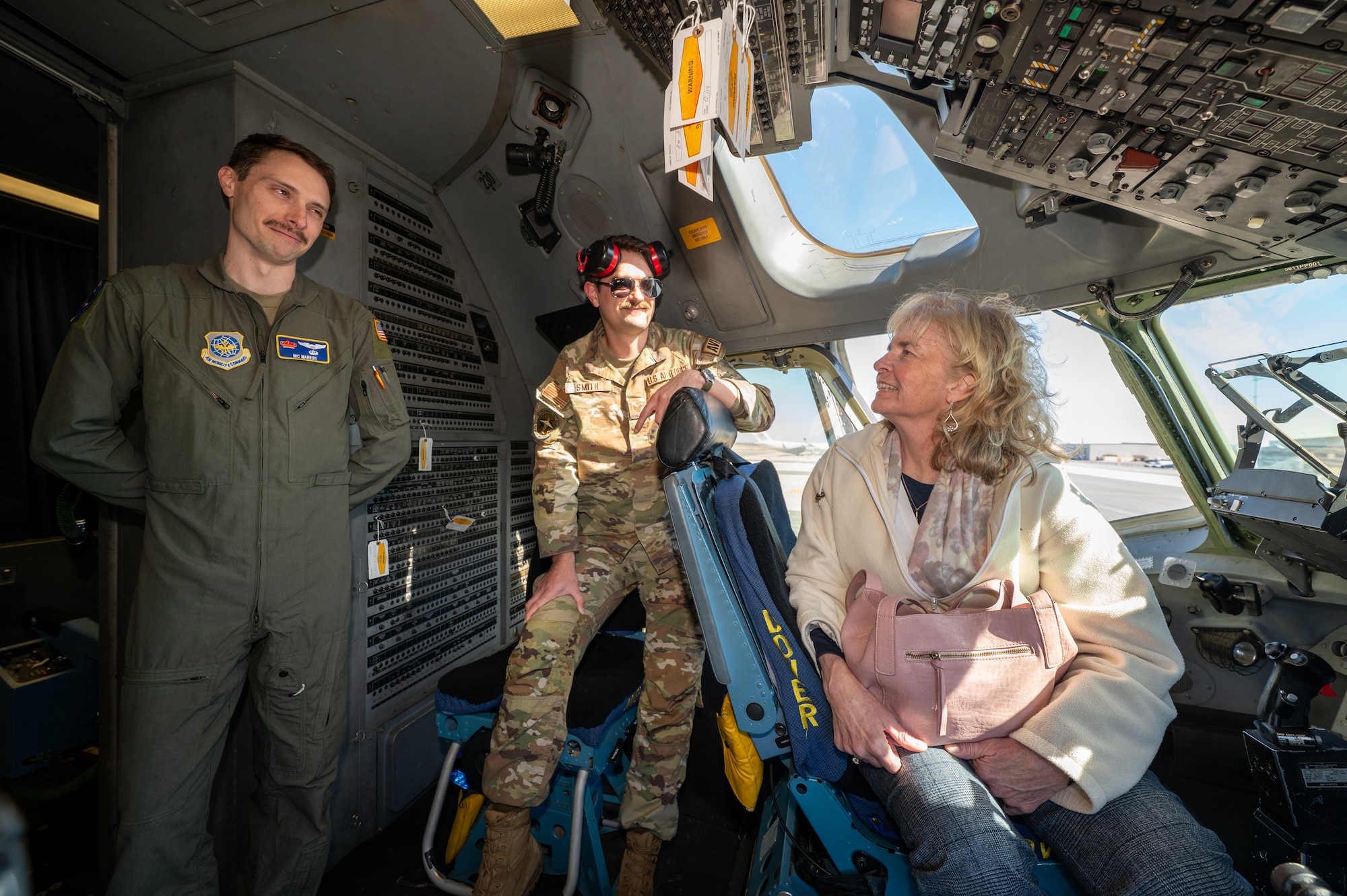 Judy Lodge, Director of Sales for the Vantage Hospitality Group and the 436th Contracting Squadron honorary commander, tours the flight deck of a C-17 Globemaster III at Dover Air Force Base, Delaware, March 24, 2026. The new class of honorary commanders toured Dover AFB and were later inducted into the HCC program during a formal ceremony that evening held at the Air Mobility Command Museum. (U.S. Air Force photo by Mauricio Campino)