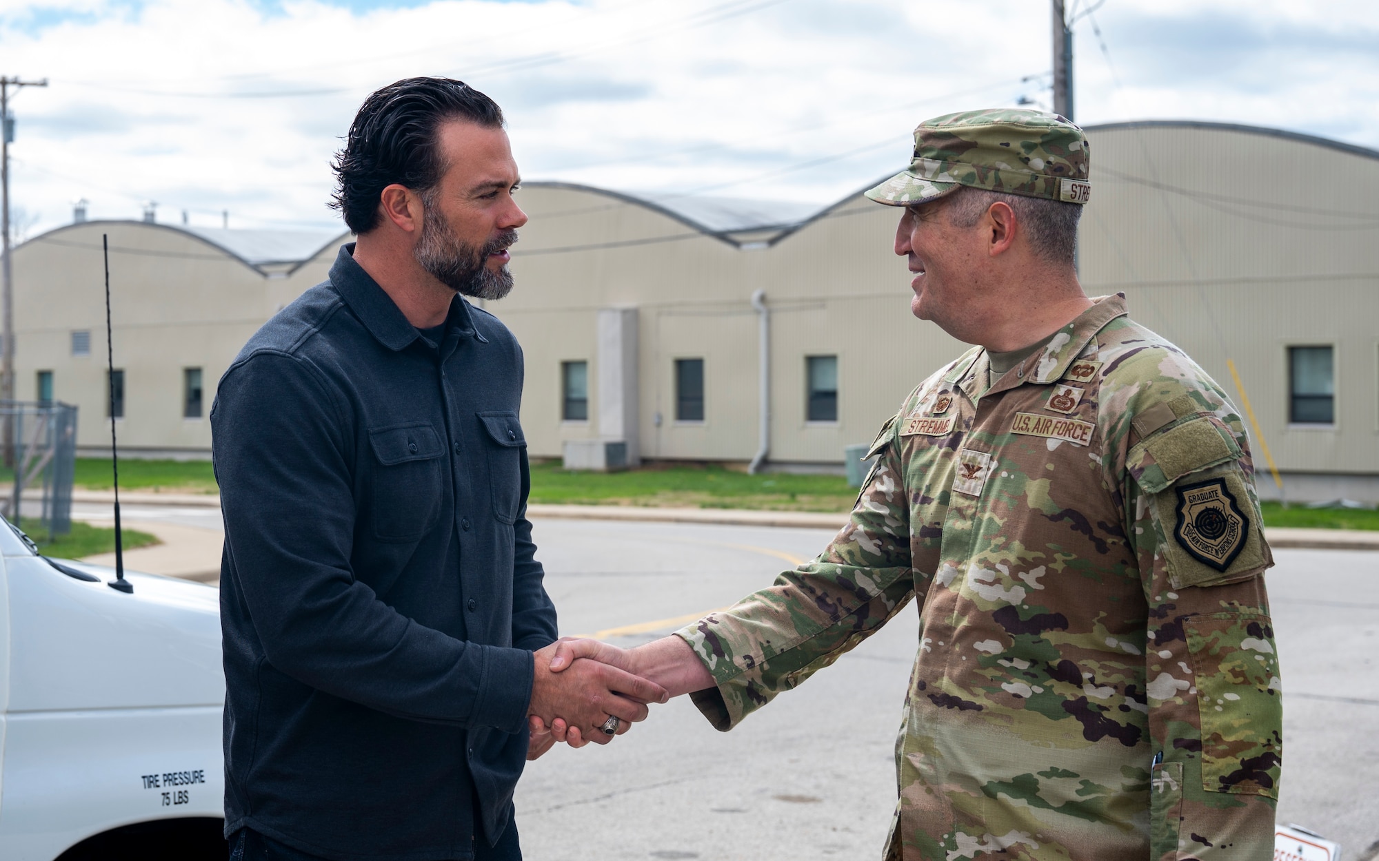 U.S. Air Force Col. Kenneth Stremmel, right, National Air and Space Intelligence Center commander, welcomes Under Secretary of the Air Force Matt Lohmeier during a visit to NASIC, Wright-Patterson Air Force Base, Ohio, March 23, 2026.