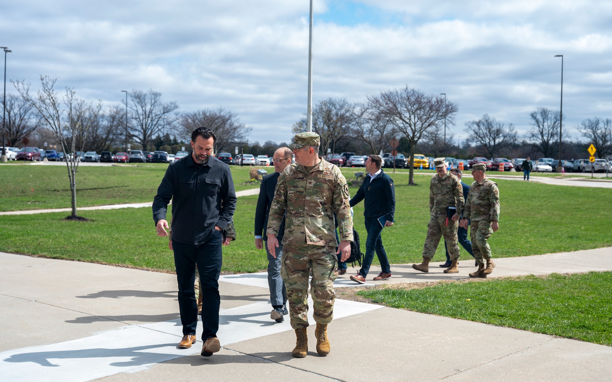 Under Secretary of the Air Force Matt Lohmeier, left, walks with U.S. Air Force Col. Kenneth Stremmel, right, National Air and Space Intelligence Center commander, while heading to a briefing location at NASIC, Wright-Patterson Air Force Base, Ohio, March 23, 2026.