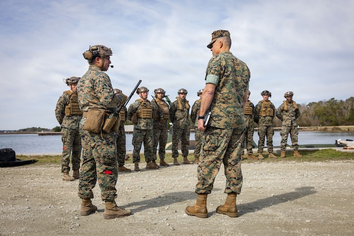 U.S. Marine Corps 1st Lt. Sylvester Guillermo, left, officer in charge of the Maritime Distribution Platoon, 2nd Distribution Support Battalion, introduces the Marines and Sailors of Maritime Distribution Platoon to Maj. Gen. Andrew Niebel, Assistant Deputy Commandant of Installations and Logistics, at Marine Corps Base Camp Lejeune, North Carolina, March 18, 2026. Niebel and Brig. Gen. Maura M. Hennigan received a demonstration and information for the autonomous low-profile vessel and other innovation efforts being used within 2nd MLG. Niebel is a native of Maryland. (U.S. Marine Corps photo by Staff Sgt. Makayla Elizalde)