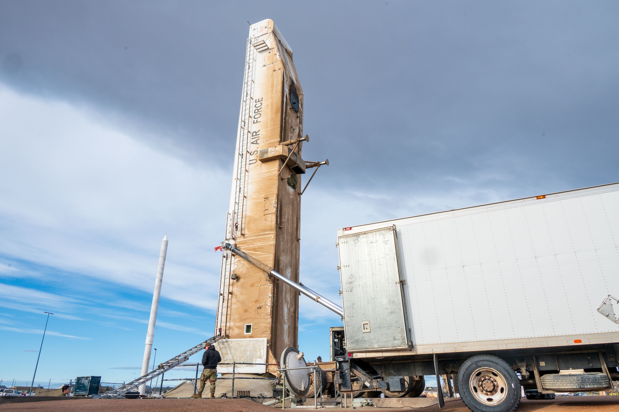 A Payload Transporter Erector is placed over a missile silo.