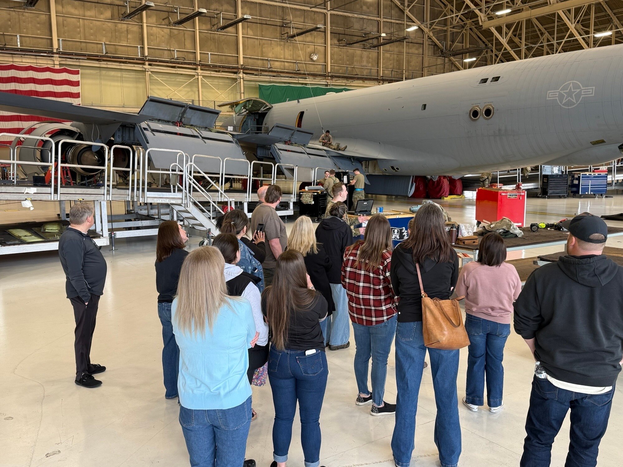 U.S. Air Force Senior Airman Maxwell Lecuyer, 92nd Maintenance Squadron crew chief, briefs members of the Medical Lake School District