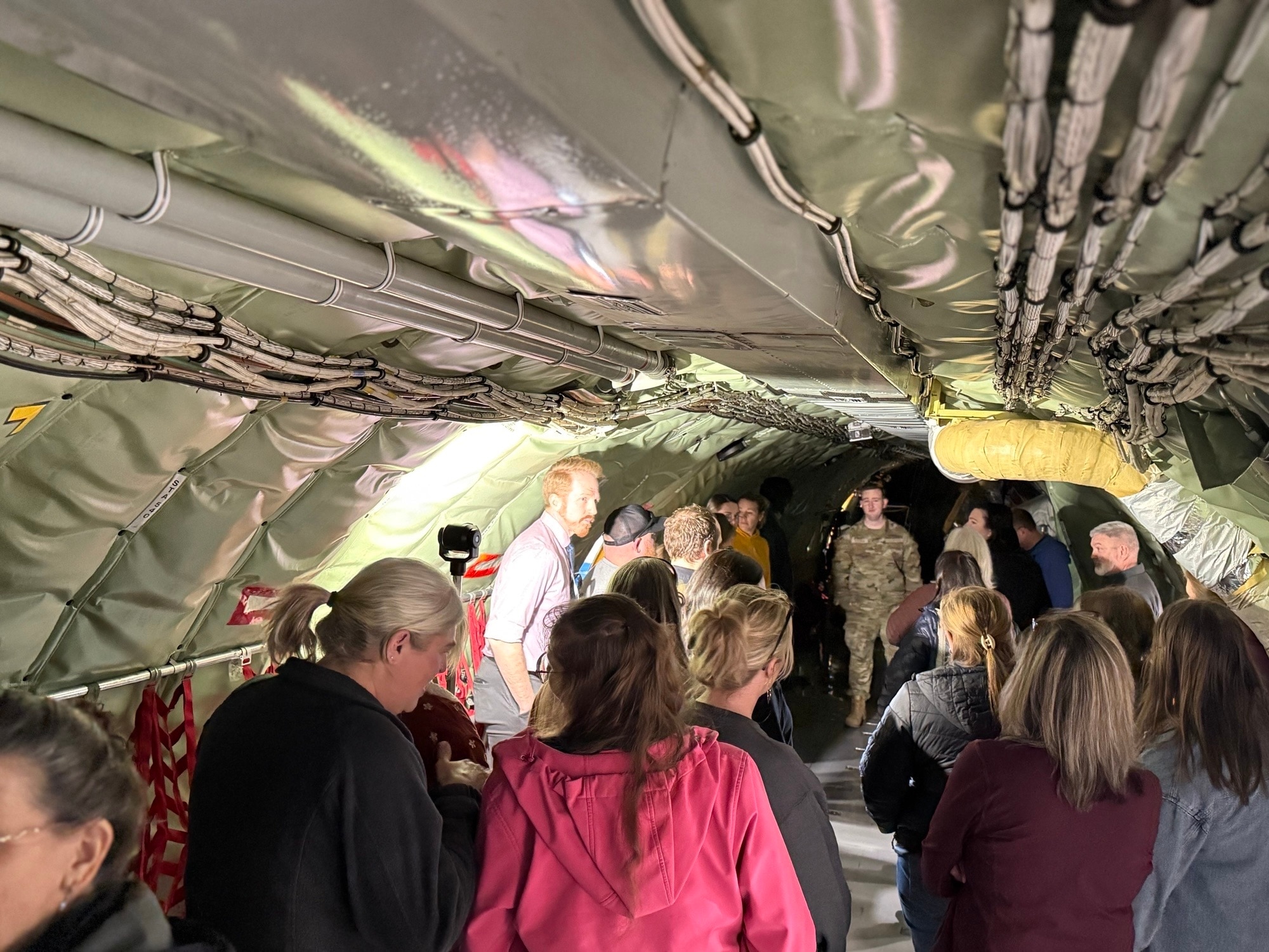 Members of the Medical Lake School District walk through the inside of a KC-135 Stratotanker.