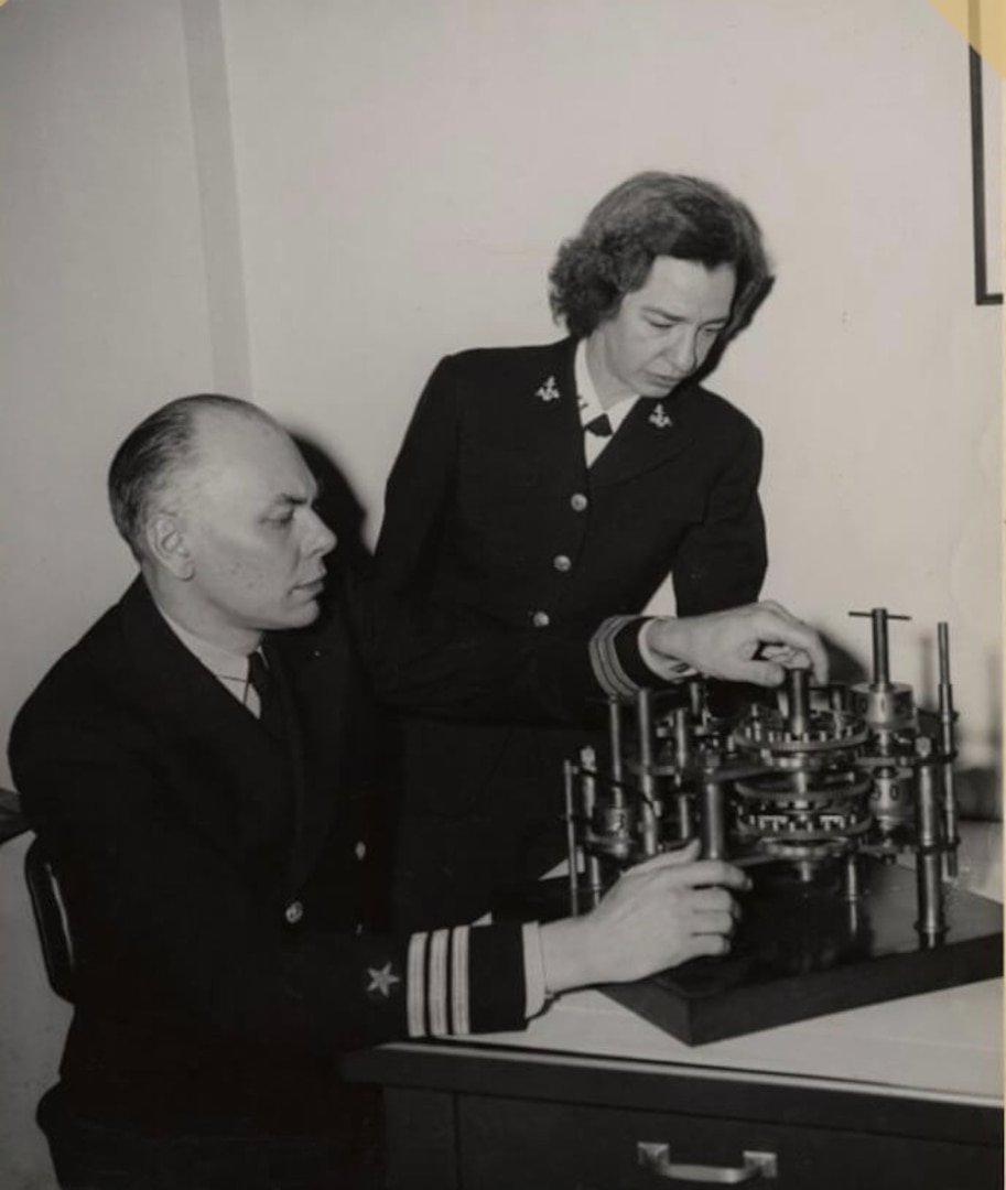 Cmdr. Howard Aiken and Lt. Grace Hopper working together, 1946. Their work on early computing systems helped lay the foundation for programming approaches that later enabled large organizations, including the Navy, to standardize software processes across multiple platforms. © Grace Murray Hopper Collection, Archives Center, National Museum of American History, Smithsonian Institution.