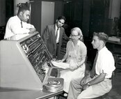 Grace Hopper with three other programmers and the operator's console of the UNIVAC I computer, 1957. Hopper’s work on early computing systems helped advance programming methods that made large-scale, reliable data processing possible across government and defense organizations. (Photo Courtesy of the Computer History Museum)