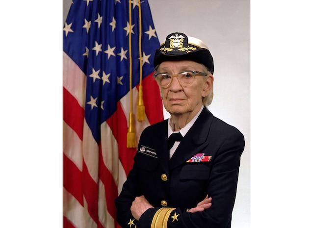 Commodore Grace Hopper’s Navy portrait from 1984, when she was promoted to Commodore. Hopper’s career combined technical innovation with enterprise-level process improvements that strengthened the Navy’s ability to manage and standardize complex computing systems.