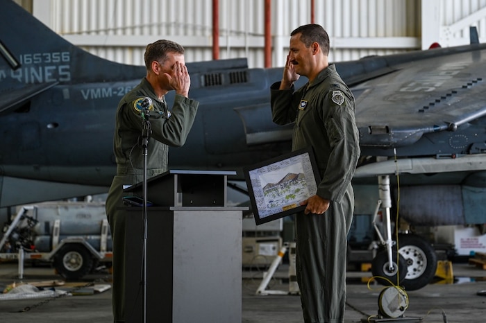 U.S. Air Force Maj. Gen. David A. Mineau, left, Air Forces Southern commander, presents a gift to Col. Benjamin A. Donberg, right, 346th Air Expeditionary Wing outbound commander, during a change of command ceremony at Ceiba, Puerto Rico, March 15, 2026. U.S. military forces are deployed to the Caribbean in support of the U.S. Southern Command mission, Department of War-directed operations, and the president’s priorities to disrupt illicit drug trafficking and protect the homeland. (U.S. Air Force photo)