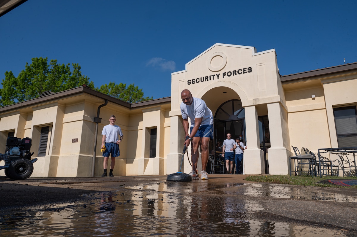 U.S. Air Force Chief Master Sgt. Eric Adams, 42d Security Forces Squadron senior enlisted leader, pressure washes the 42d SFS front entrance during the wing’s Base Beautification Day at Maxwell Air Force Base, Alabama, March 26, 2026.