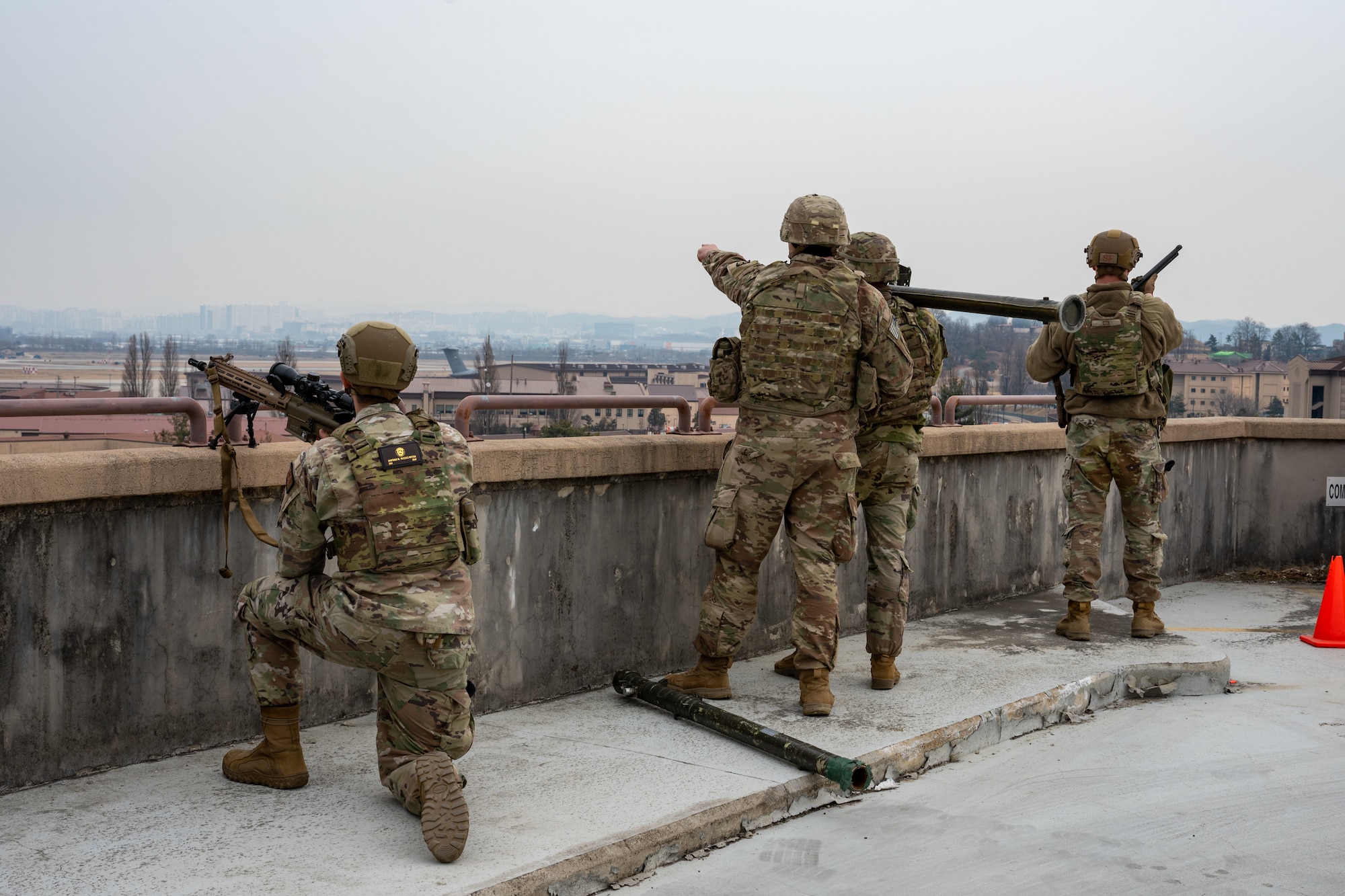 Airmen and Soldiers scan the sky for a small, unmanned aircraft system.