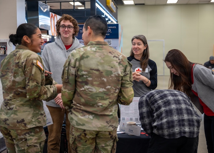 Jordan Jacobs, second from right, American Red Cross regional program manager and 51st Logistics Readiness Squadron key support liaison, and Red Cross volunteers offer free CPR classes at Osan Air Base, Republic of Korea, March 23, 2026. Jacobs has dedicated her time at Osan to building connections, strengthening community and ensuring families know exactly where to turn when they need help. (U.S. Air Force photo by Staff Sgt. Sarah Williams)