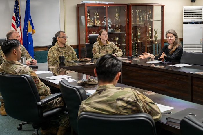 Jordan Jacobs, American Red Cross regional program manager and 51st Logistics Readiness Squadron key support liaison, provides a brief at the 51st LRS newcomers at Osan Air Base, Republic of Korea, March 26, 2026. Jacobs rebuilt the KSL program within the 51st LRS, bringing together a team of volunteers and creating resources designed to make life easier for incoming families. From detailed welcome packets to deployment support guides, her goal has always been to remove uncertainty and replace it with support and connection. (U.S. Air Force photo by Staff Sgt. Tylir Meyer)